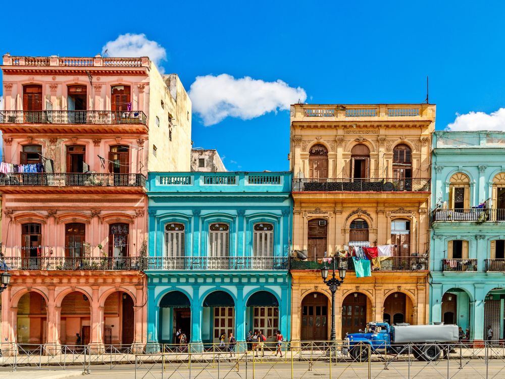 Old living colorful houses across the road in the center of Havana, Cuba