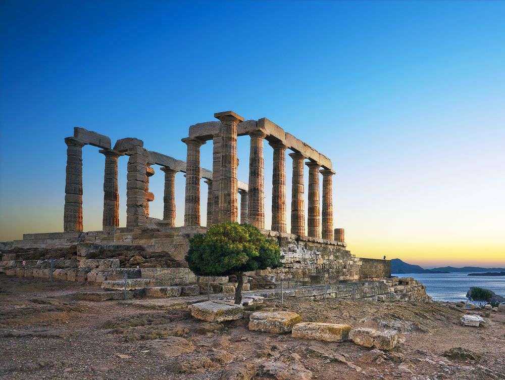 Greece. Cape Sounion - Ruins of an ancient Greek temple of Poseidon after sunset