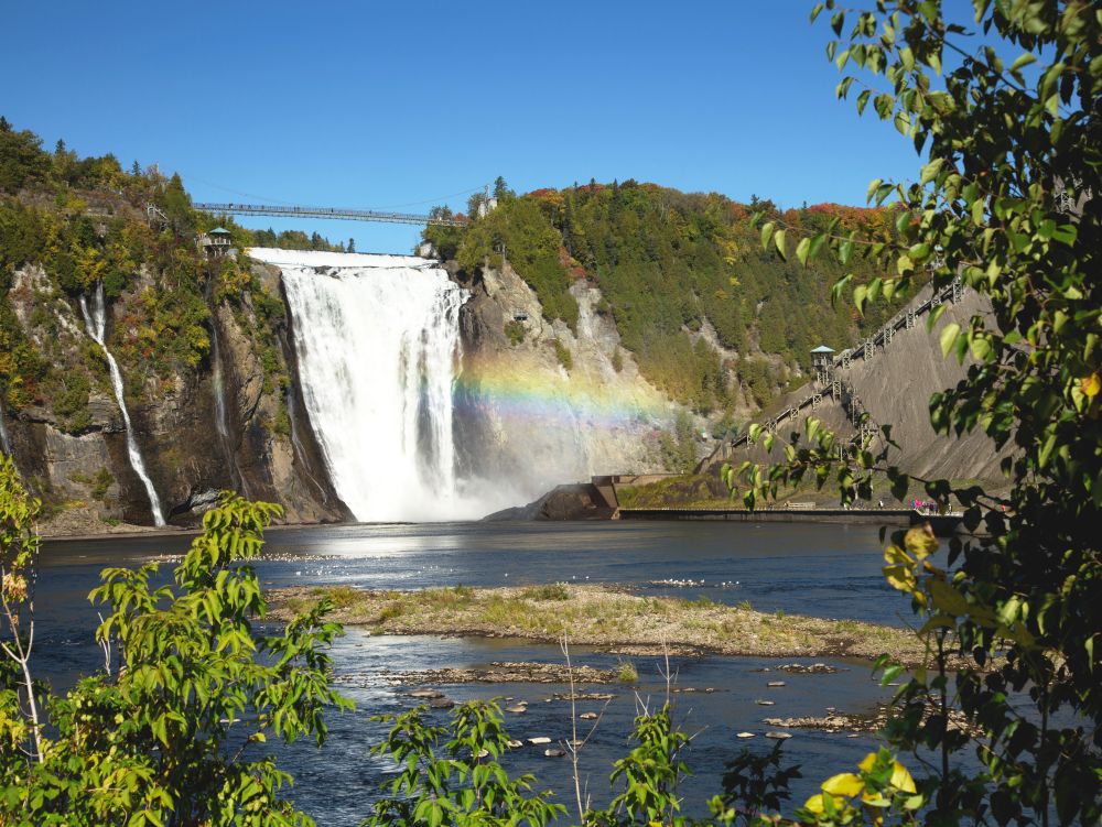 Montmorency waterfall with rainbow in Quebec, Canada