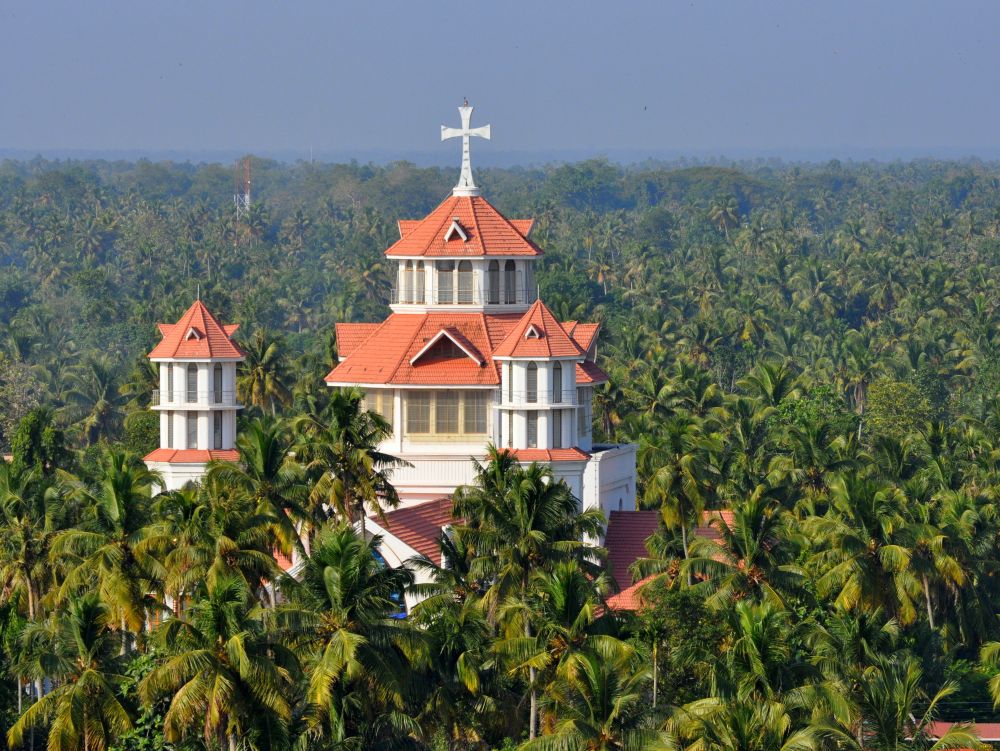 catholic church in Kerala India and abundance of coconut palm trees
