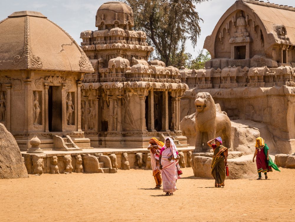 Hindu women visiting ancient Hindu monolithic, Pancha Rathas - Five Rathas, Mahabalipuram, Tamil Nadu, India