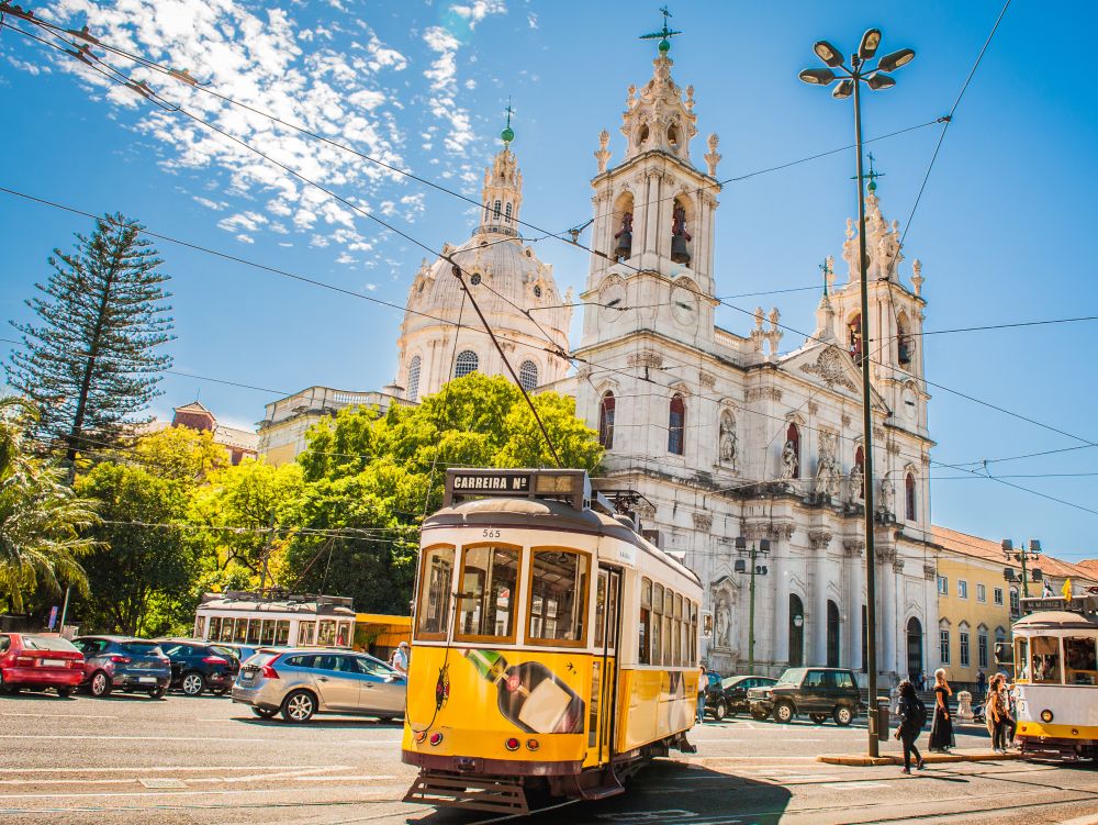 Yellow tram 28 on streets of Lisbon, Portugal